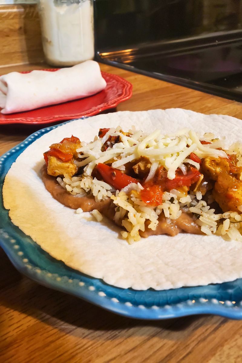 Quick and easy Instant Pot chicken fajita dinner on a plate.